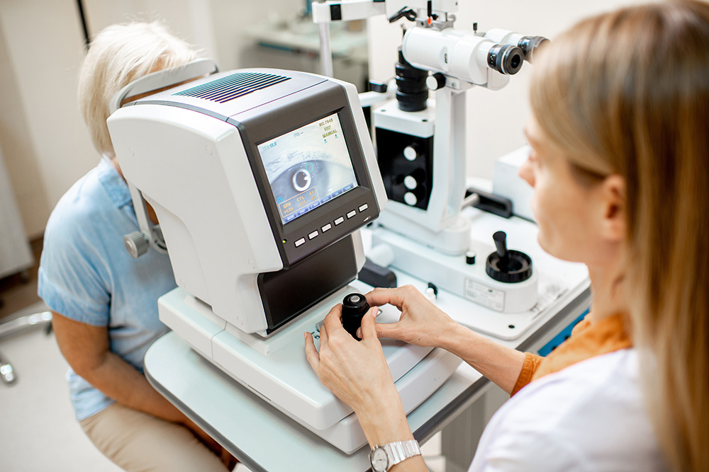 Ophthalmologist examining eyes of a senior patient